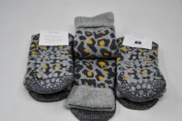 Ten pairs of as new Somerville Leopard slipper socks in grey/yellow (One size - RRP £20 each).