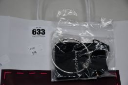 Two pre-owned Pandora bracelets with charms.