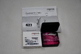 A boxed as new Signia Contrast S+ hearing aid in silver.