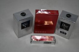 Two boxed as new Dior Homme eau de toilette (50ml), one boxed as new Gucci Rush (50ml) and one boxed