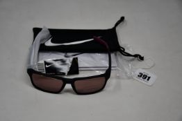 A pair of as new Nike Maverick RGE E sunglasses with protective pouch (RRP £137).