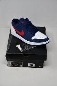 A pair of as new Nike Air Jordan 1 Low SE trainers (UK 6).