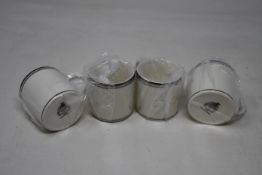 A quantity of as new Pickard hand decorated china to include six espresso cup sets and twelve