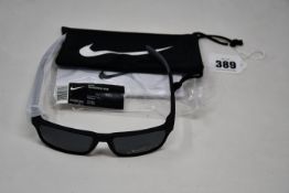A pair of as new Nike Maverick RGE E sunglasses with protective pouch (RRP £137).