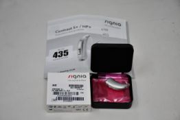 A boxed as new Signia Contrast S+ hearing aid in silver.