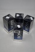 Four boxed as new Hugo Boss Bottled Night eau de toilette (100ml).