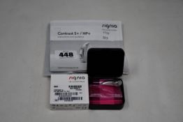 A boxed as new Signia Contrast S+ hearing aid in silver.