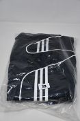 Two pairs of as new Adidas Strike track pants (L) and three Strike track jackets (L).