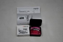A boxed as new Signia Contrast S+ hearing aid in silver.