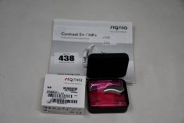 A boxed as new Signia Contrast S+ hearing aid in silver.