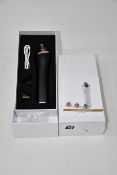 Two boxed as new handheld portable microdermabrasion tools.