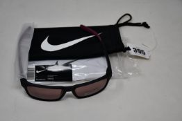 A pair of as new Nike Maverick RGE E sunglasses with protective pouch (RRP £137).
