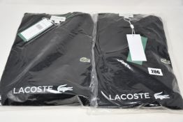 Two as new Lacoste sweaters (US L, XL).