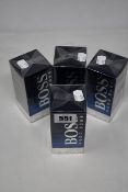 Four boxed as new Hugo Boss Bottled Night eau de toilette (100ml).