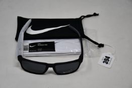 A pair of as new Nike Maverick RGE E sunglasses with protective pouch (RRP £137).