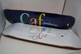 Three as new Skateboard decks to include one Skateboard Café 8.375 Ronald Skateboard, one Skateboard