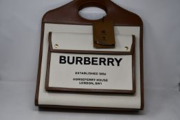 An as new Burberry medium two-tone Pocket bag (RRP £1,190).