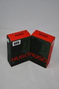 Two boxed as new Hugo Man eau de toilette (200 ml).