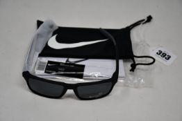A pair of as new Nike Maverick RGE E sunglasses with protective pouch (RRP £137).