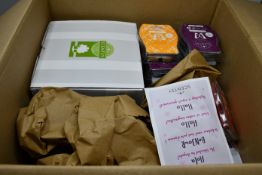 Two boxed as new Scentsy candles and related items to include Bali mini warmer with table top