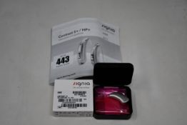 A boxed as new Signia Contrast S+ hearing aid in silver.