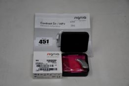 A boxed as new Signia Contrast S+ hearing aid in silver.
