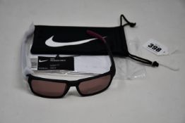 A pair of as new Nike Maverick RGE E sunglasses with protective pouch (RRP £137).
