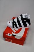 A pair of as new Nike air More Uptempo trainers (UK 3.5).