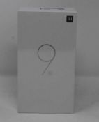 A boxed as new Xiaomi Mi 9 SE Global Version 6GB RAM 64GB Storage Android Smartphone in Piano Black