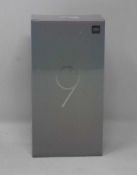 A boxed as new Xiaomi Mi 9 Global Version 6GB RAM 128GB Storage Android Smartphone in Ocean Blue