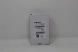 A boxed as new Trimble Rechargeable Li-Ion Battery For Robotic Total Stations (P/N: 99511-30).