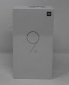 A boxed as new Xiaomi Mi 9 SE Global Version 6GB RAM 128GB Storage Android Smartphone in Piano Black