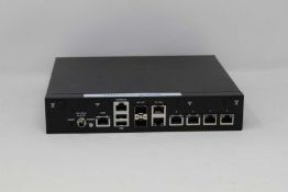 A pre-owned Lanner NCA-1515A-VZ1-PB Desktop Network Appliance (Boxed with power supply and cables).