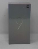 A boxed as new Xiaomi Mi 9 Global Version 6GB RAM 128GB Storage Android Smartphone in Ocean Blue .