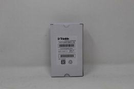 A boxed as new Trimble PM410 FRU Power Module (P/N:97054-10) (Box opened, some cosmetic damage to