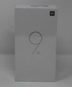 A boxed as new Xiaomi Mi 9 SE Global Version 6GB RAM 128GB Storage Android Smartphone in Piano Black