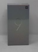 A boxed as new Xiaomi Mi 9 Global Version 6GB RAM 64GB Storage Android Smartphone in Ocean Blue