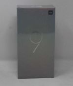 A boxed as new Xiaomi Mi 9 Global Version 6GB RAM 128GB Storage Android Smartphone in Ocean Blue