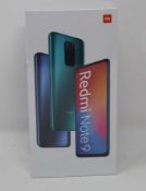 A boxed as new Redmi Note 9 Android Mobile Phone 4GB RAM 128GB Storage in Forest Green (Box sealed)