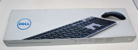A boxed as new Dell KM717 Premier Keyboard And Mouse Set (QWERTY - UK) (Box sealed, some cosmetic