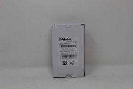A boxed as new Trimble Rechargeable Li-Ion Battery For Robotic Total Stations (P/N: 99511-30).