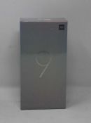 A boxed as new Xiaomi Mi 9 6GB RAM 64GB Storage Android Smartphone in Ocean Blue (Box sealed, some