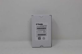 A boxed as new Trimble Rechargeable Li-Ion Battery For Robotic Total Stations (P/N: 99511-30).