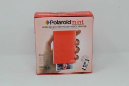 A boxed as new Polaroid Mint Wireless Instant Pocket Printer in Red (M/N: POLMP02R) (Box sealed).