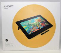 A pre-owned Wacom Cintiq 16 Creative Pen Display with pen, power supply, cables and original box (