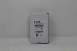 A boxed as new Trimble Rechargeable Li-Ion Battery For Robotic Total Stations (P/N: 99511-30).