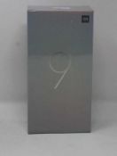 A boxed as new Xiaomi Mi 9 Global Version 6GB RAM 128GB Storage Android Smartphone in Piano Black