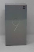 A boxed as new Xiaomi Mi 9 Global Version 6GB RAM 128GB Storage Android Smartphone in Piano Black