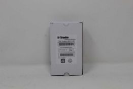 A boxed as new Trimble Rechargeable Li-Ion Battery For Robotic Total Stations (P/N: 99511-30).
