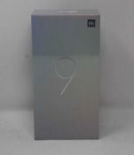 A boxed as new Xiaomi Mi 9 Global Version 6GB RAM 64GB Storage Android Smartphone in Ocean Blue